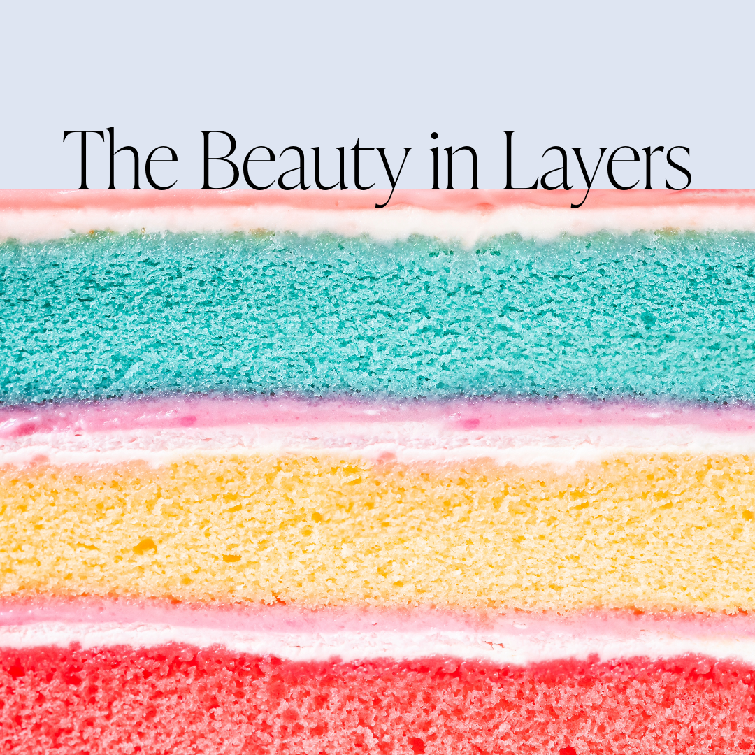 The Beauty in Layers text on top of layers of cut cake.